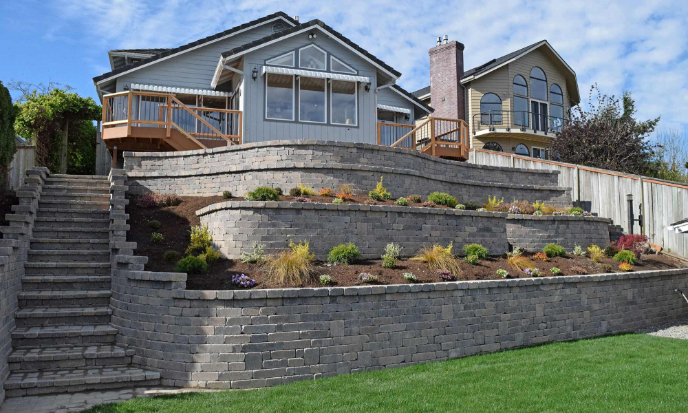 Professional retaining wall contractors building a sturdy and beautiful landscape in Tacoma